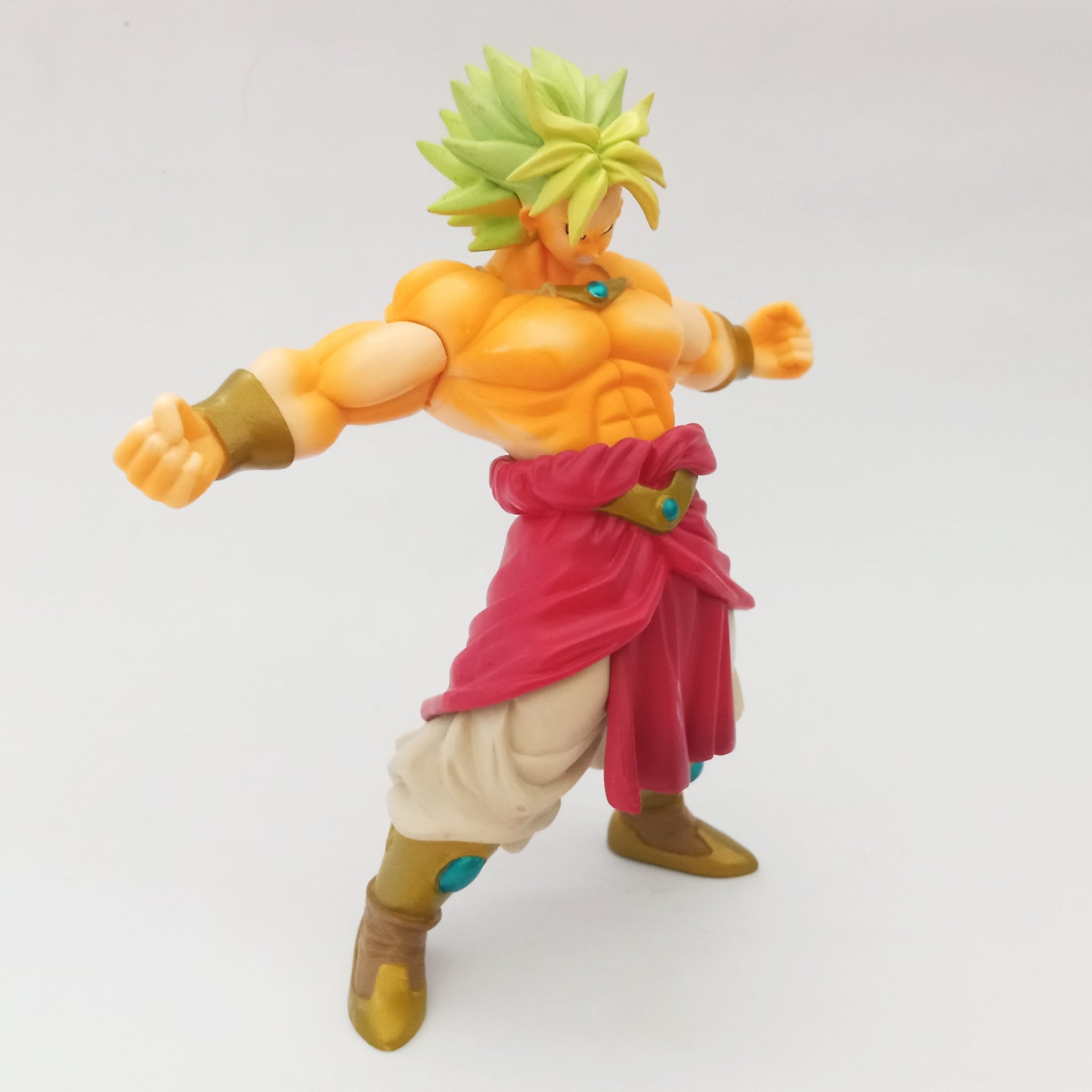 goku from dragon ball z in a fighting stance pose super saiyan yellow hair  pretty eyes shirtless grey background angry fullbody facing viewer looking  at viewer